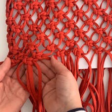 Step 17: Knot bottom edge